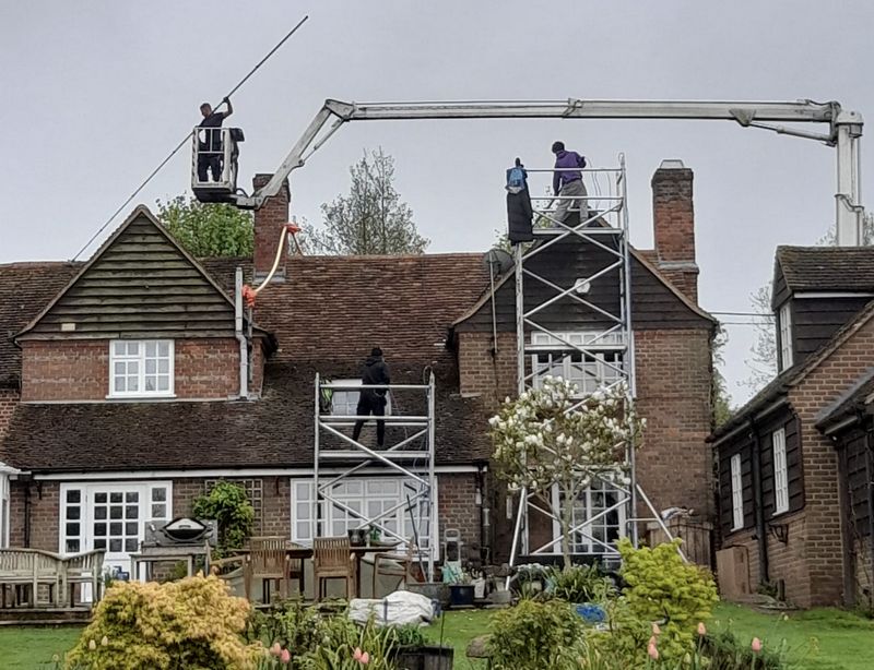The Roof Moss Cleaners using cherry picker and scaffolding to clean roof safely and professionally in Wroughton, Wiltshire